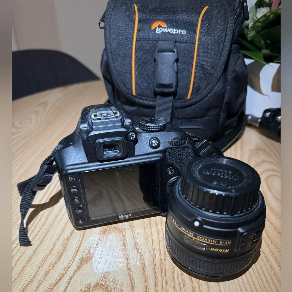 Nikon D3400 DSLR like new with 2 different lenses-batteries-bag and camera stand